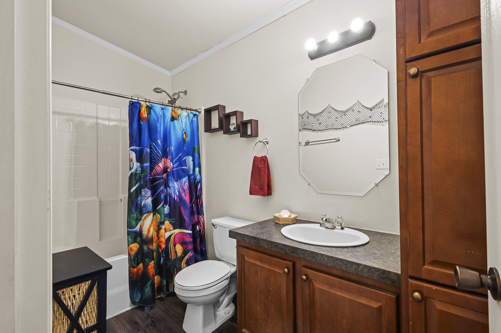 175 Fawn Ridge Road Cedar Creek, TX 78612 - Photo 23 of 34 a bathroom with a sink toilet mirror and vanity