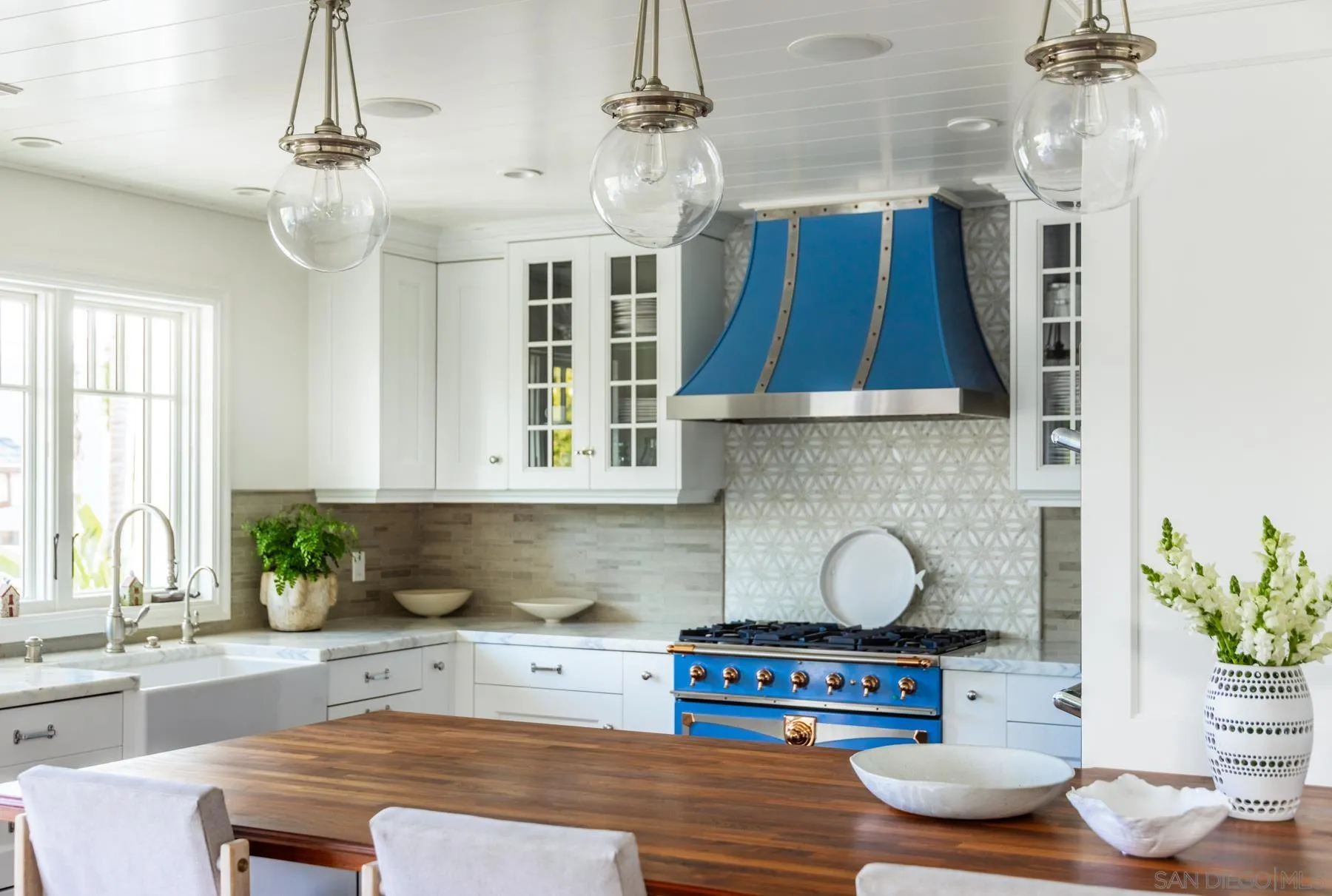 219 27th Street Del Mar, CA 92014 - Photo 18 of 47 a kitchen with kitchen island granite countertop a sink and a stove