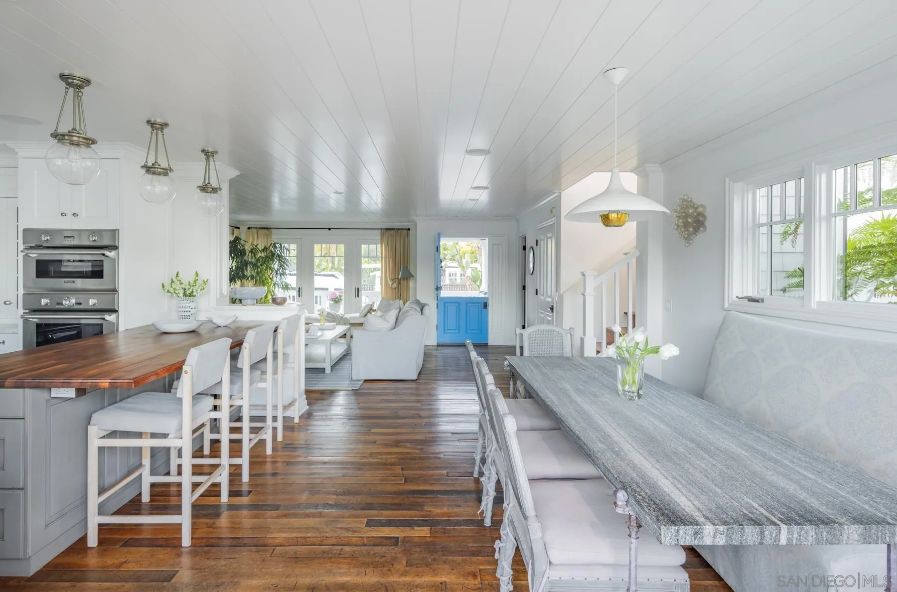 219 27th Street Del Mar, CA 92014 - Photo 25 of 47 a large kitchen with a table and chairs