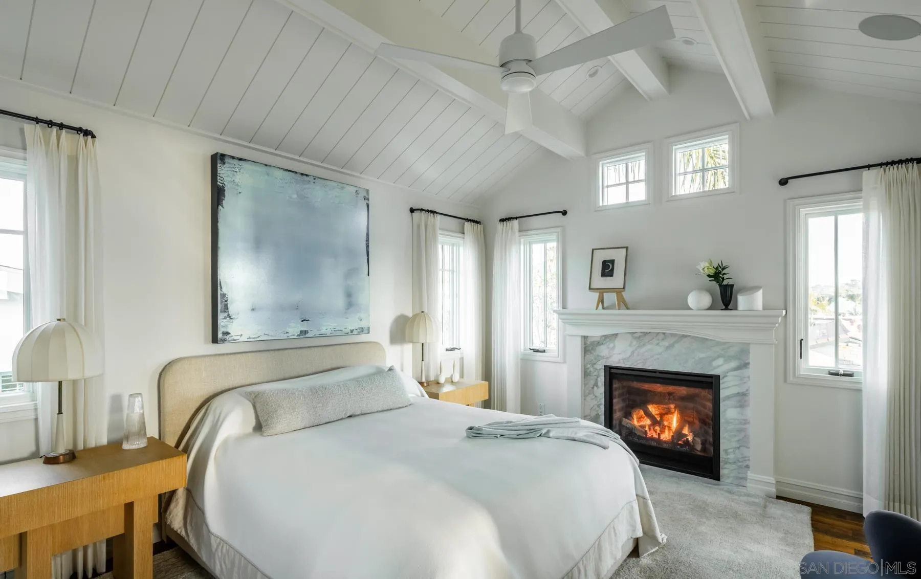 219 27th Street Del Mar, CA 92014 - Photo 30 of 47 a bedroom with a bed and a fireplace