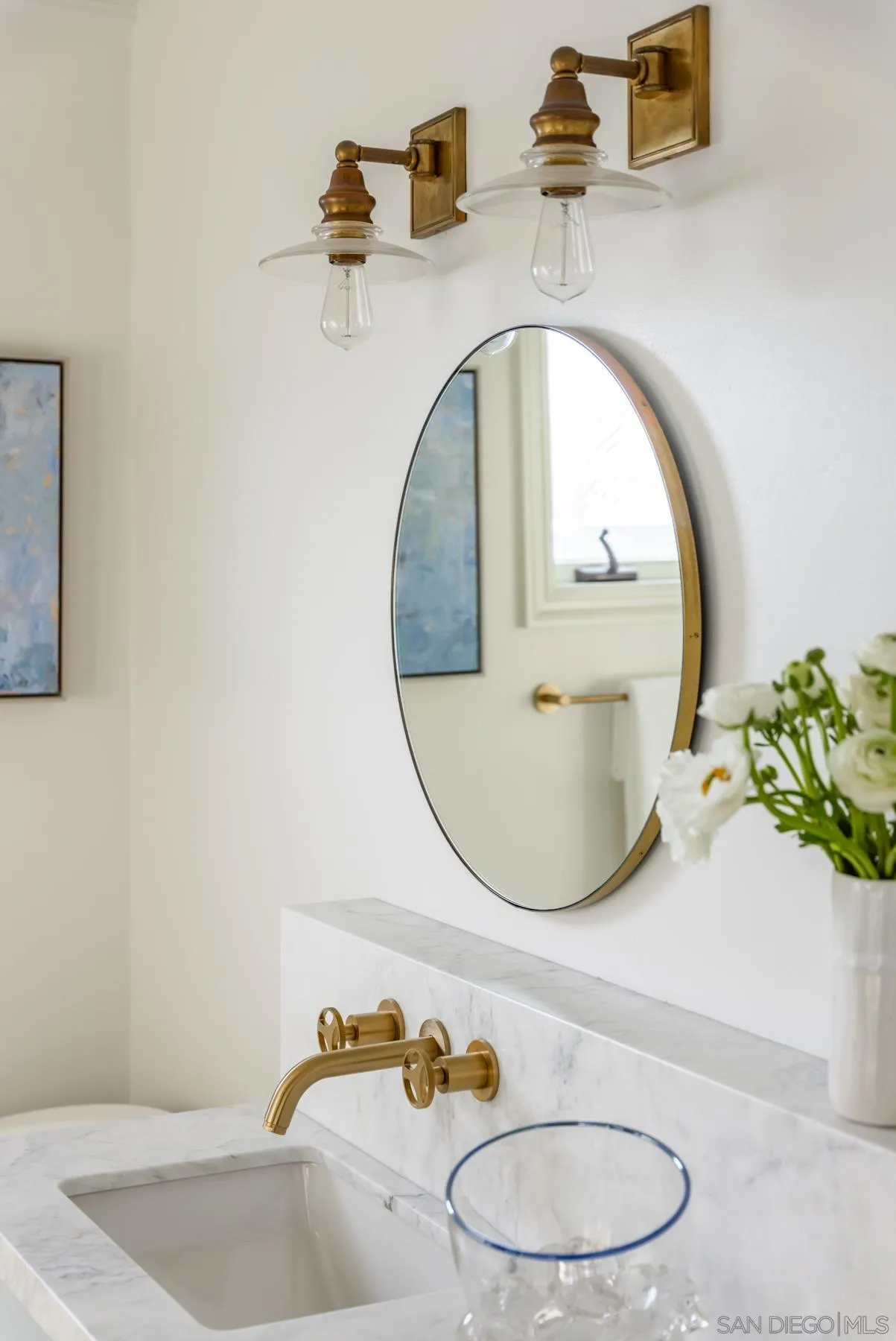 219 27th Street Del Mar, CA 92014 - Photo 36 of 47 a bathroom with a sink and mirror