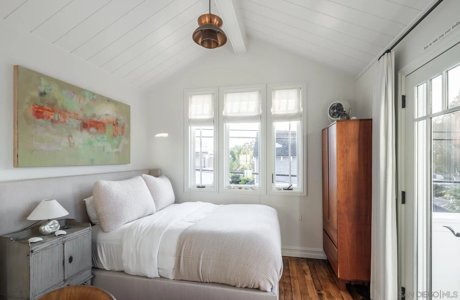 219 27th Street Del Mar, CA 92014 - Photo 38 of 47 a bedroom with a large bed and a large window