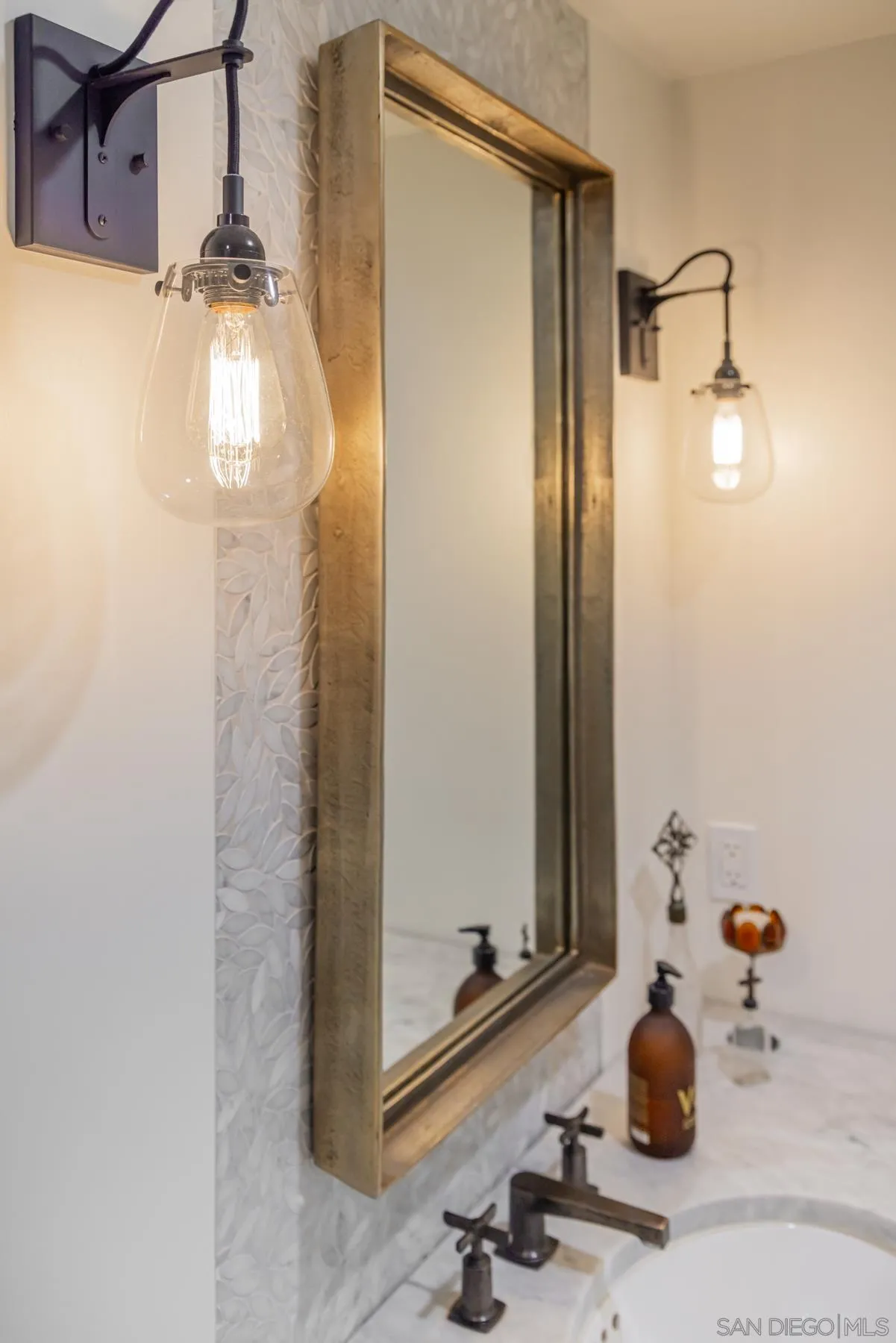 219 27th Street Del Mar, CA 92014 - Photo 41 of 47 a bathroom with a sink and mirror