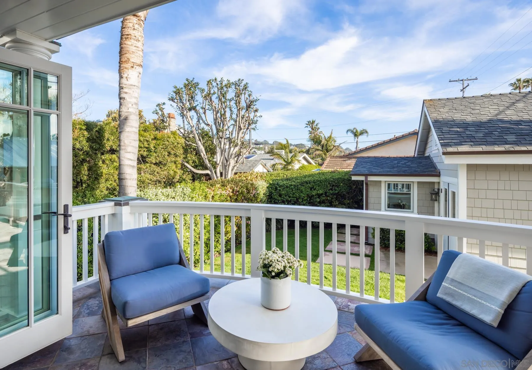 219 27th Street Del Mar, CA 92014 - Photo 45 of 47 a balcony with table and chairs