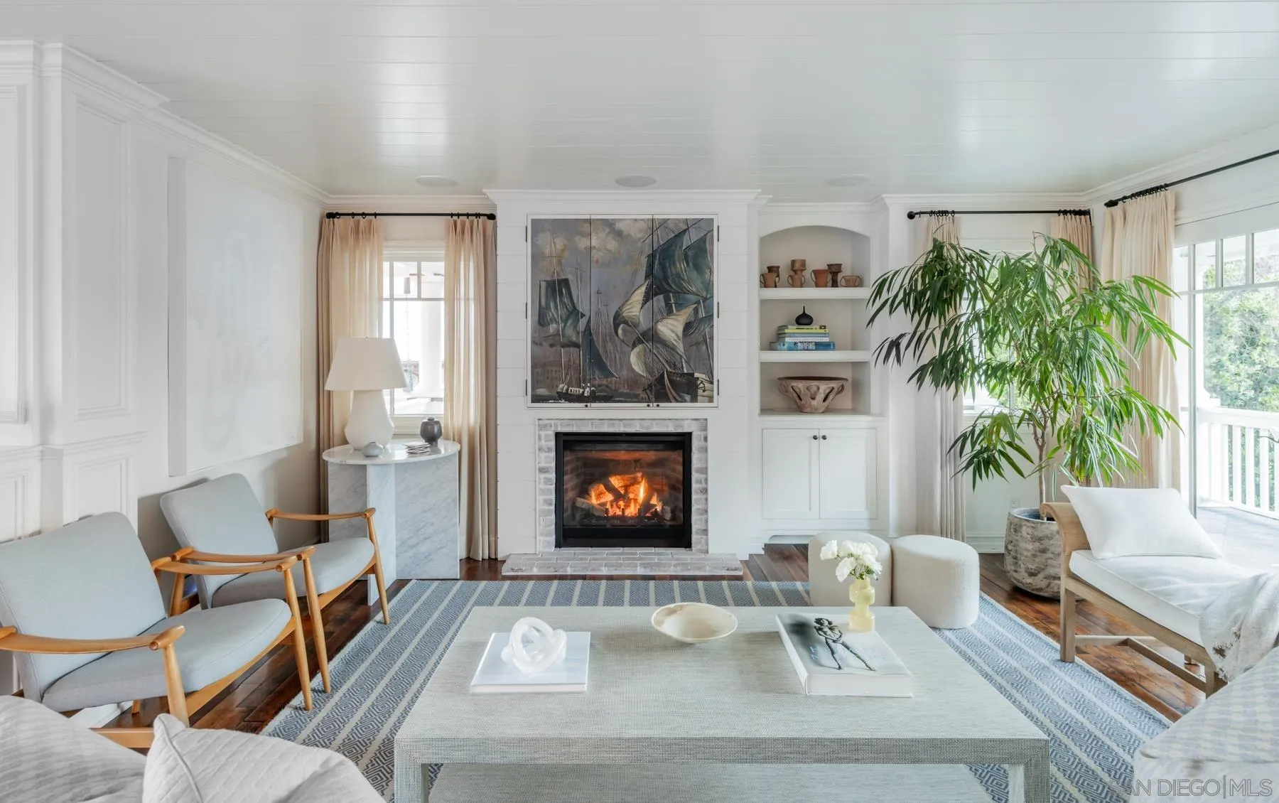 219 27th Street Del Mar, CA 92014 - Photo 9 of 47 a living room with furniture and a fireplace