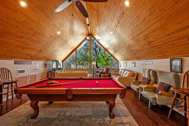 a room with furniture and pool table