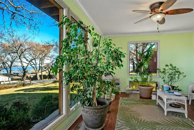 a living room with furniture potted plant and a chandelier