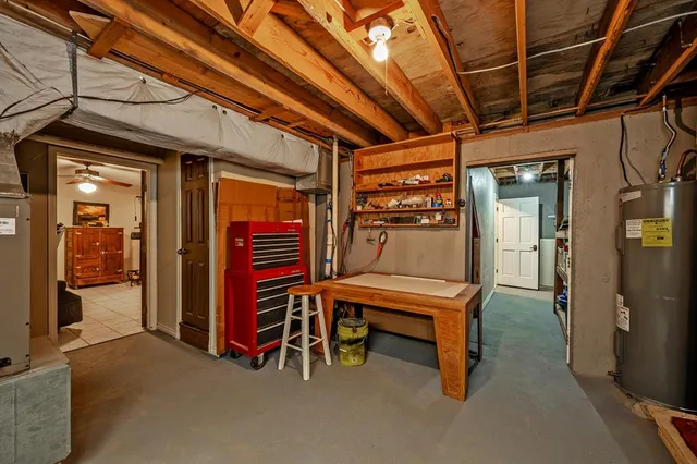 a view of a park with bench and trees