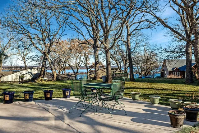 a view of swimming pool with a yard and plants