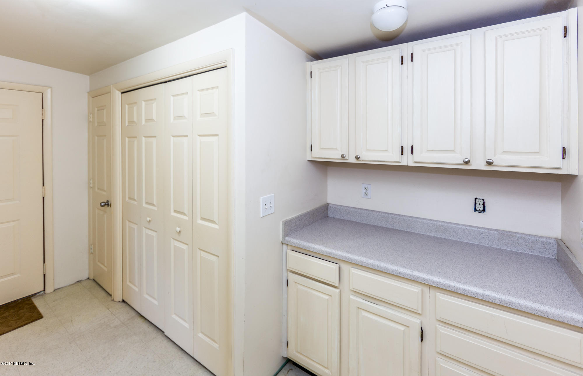 7010 Arques Road Jacksonville, FL 32205 - Photo 11 of 16 a view of cabinets and wooden floor