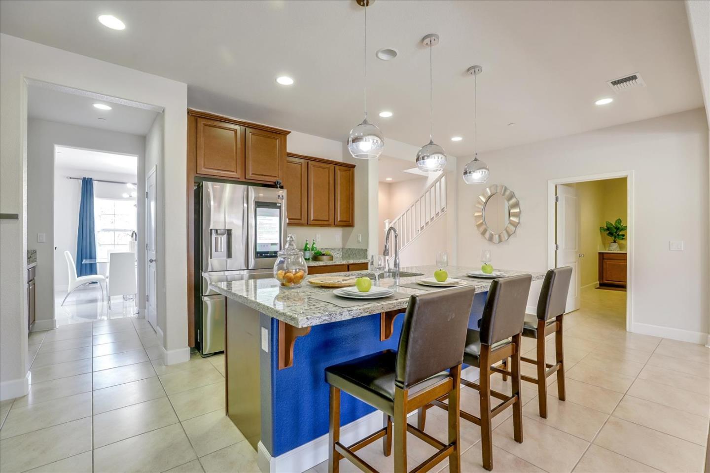 1081 Cabrillo Drive Hollister, CA 95023 - Photo 11 of 60 a kitchen with a table and chairs in it