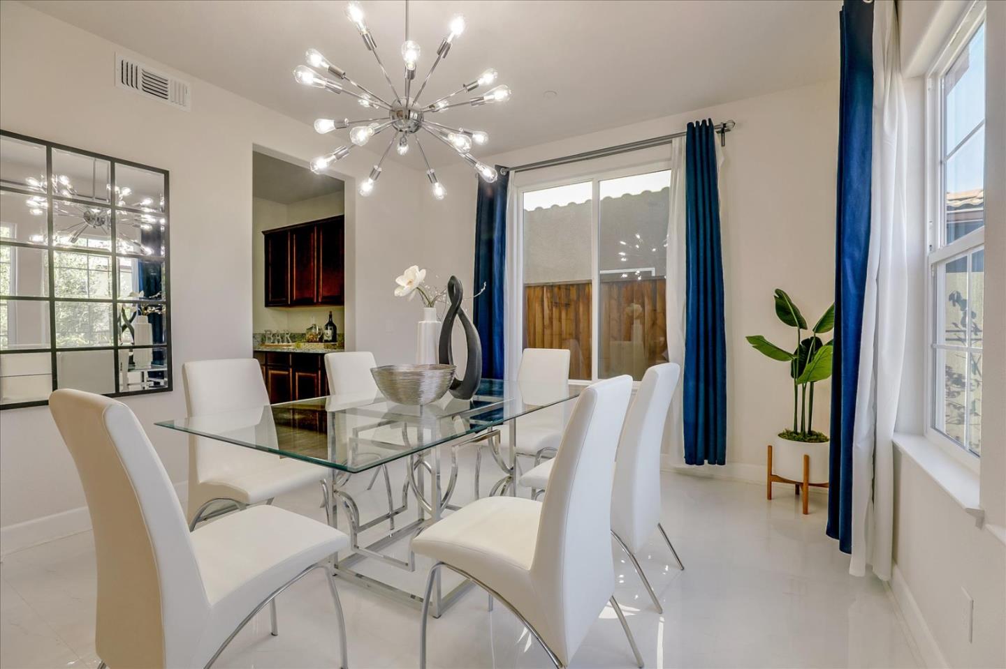 1081 Cabrillo Drive Hollister, CA 95023 - Photo 17 of 60 a view of a dining room with furniture a livingroom and chandelier