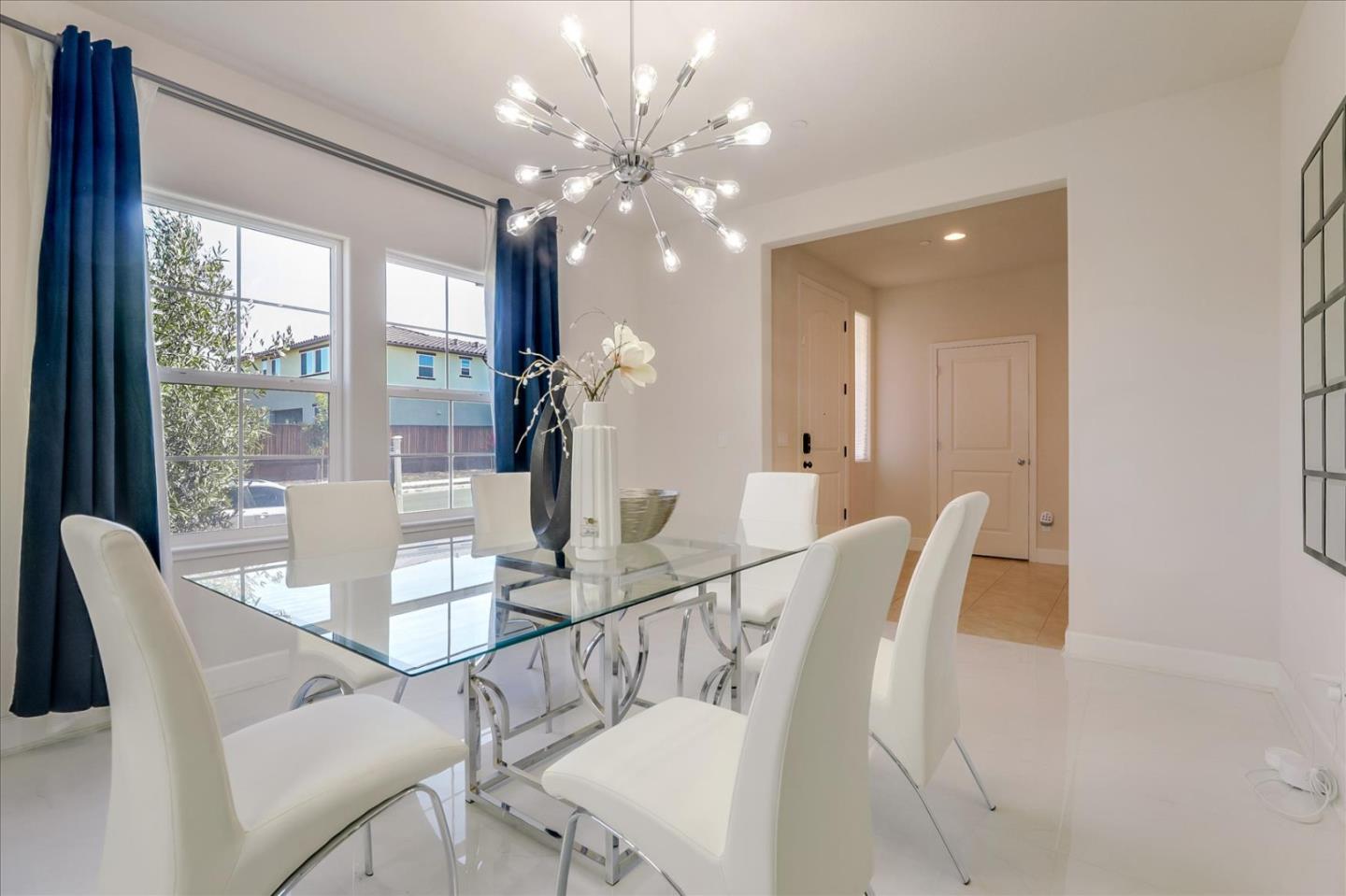 1081 Cabrillo Drive Hollister, CA 95023 - Photo 18 of 60 a view of a dining room with furniture wooden floor and chandelier