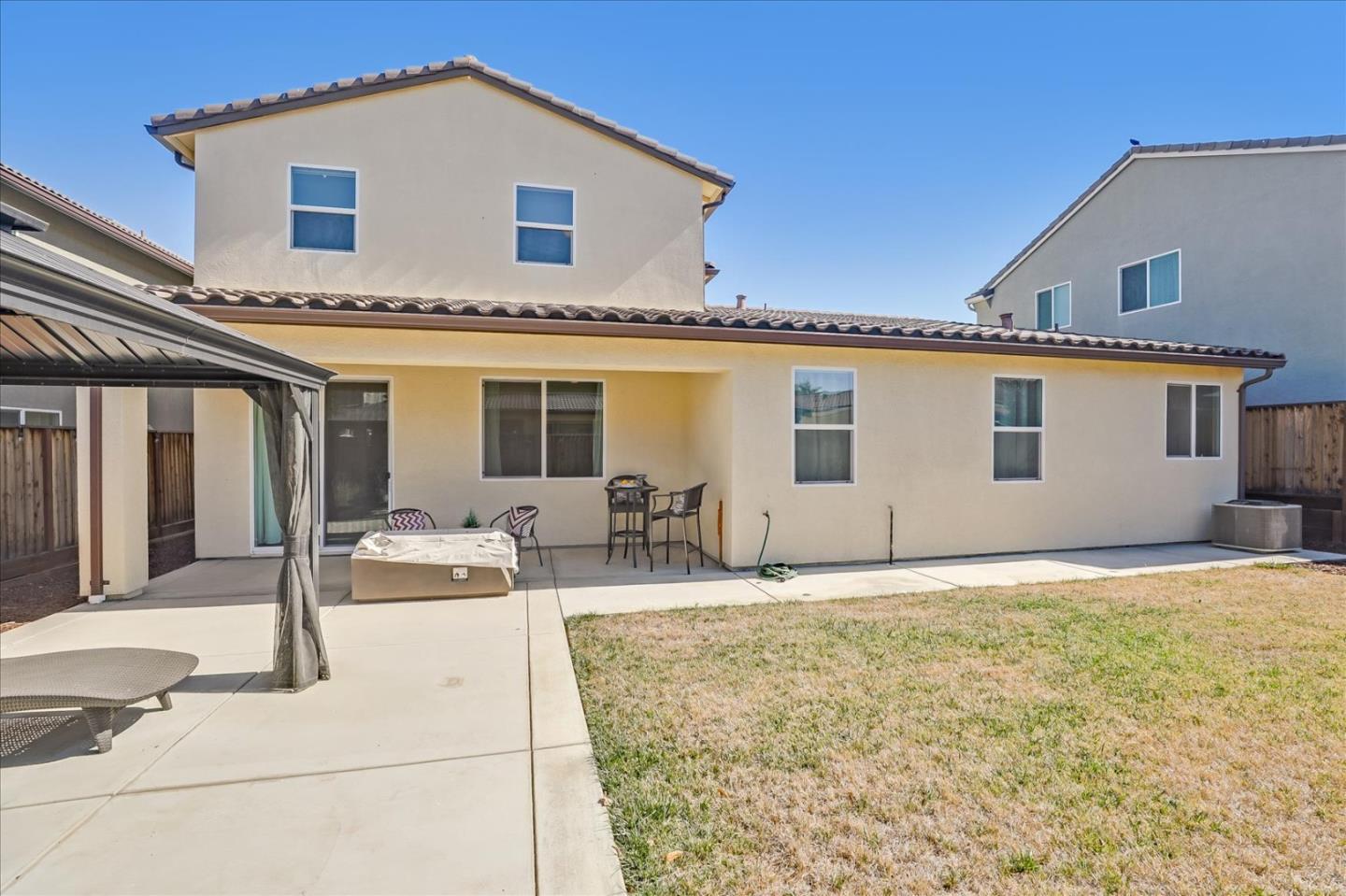 1081 Cabrillo Drive Hollister, CA 95023 - Photo 43 of 60 a front view of house with yard outdoor seating and barbeque oven