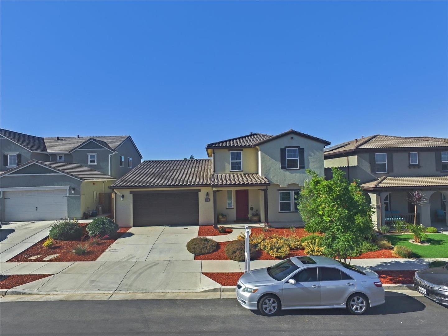 1081 Cabrillo Drive Hollister, CA 95023 - Photo 44 of 60 a car parked in front of a house