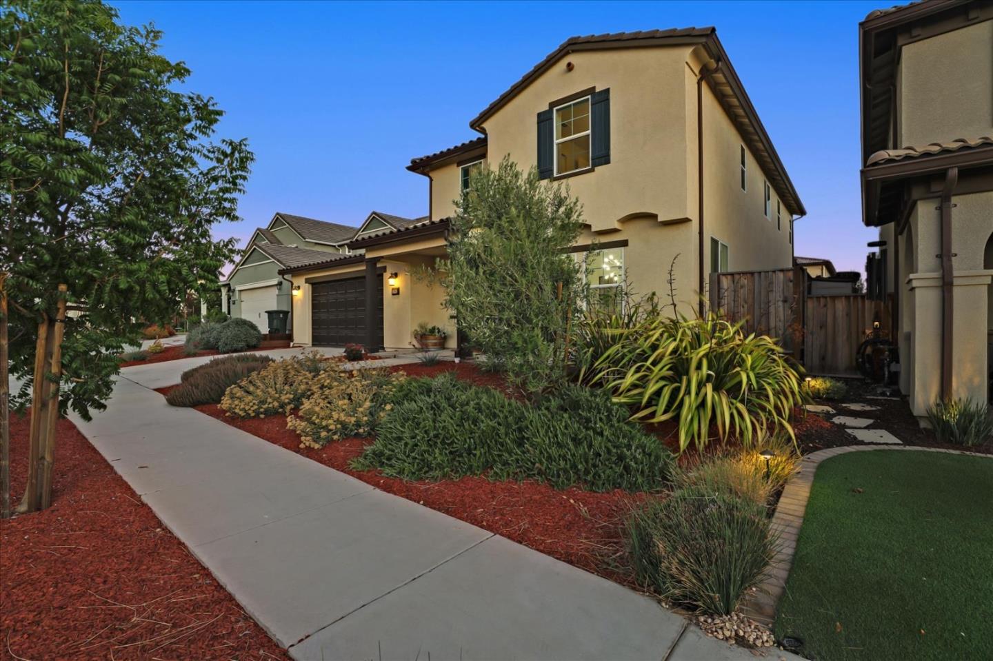 1081 Cabrillo Drive Hollister, CA 95023 - Photo 56 of 60 a front view of a house with a garden