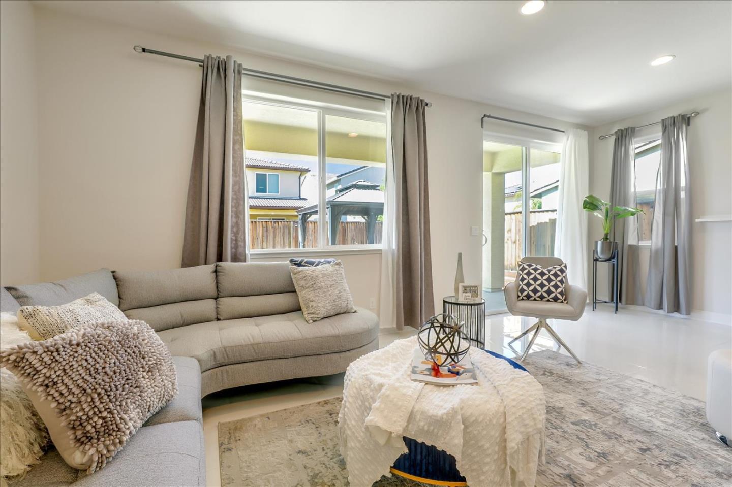 1081 Cabrillo Drive Hollister, CA 95023 - Photo 7 of 60 a living room with furniture and a large window
