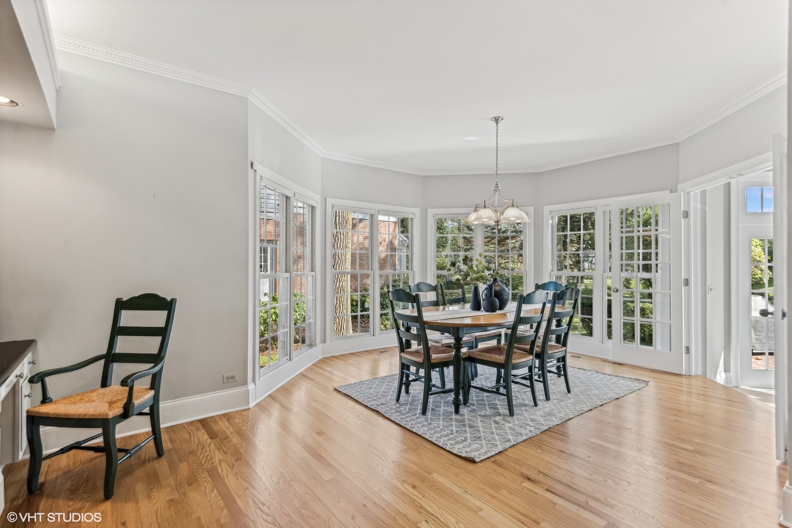 437 Stagecoach Run Glen Ellyn, IL 60137 - Photo 16 of 45 a dining room with furniture window and wooden floor