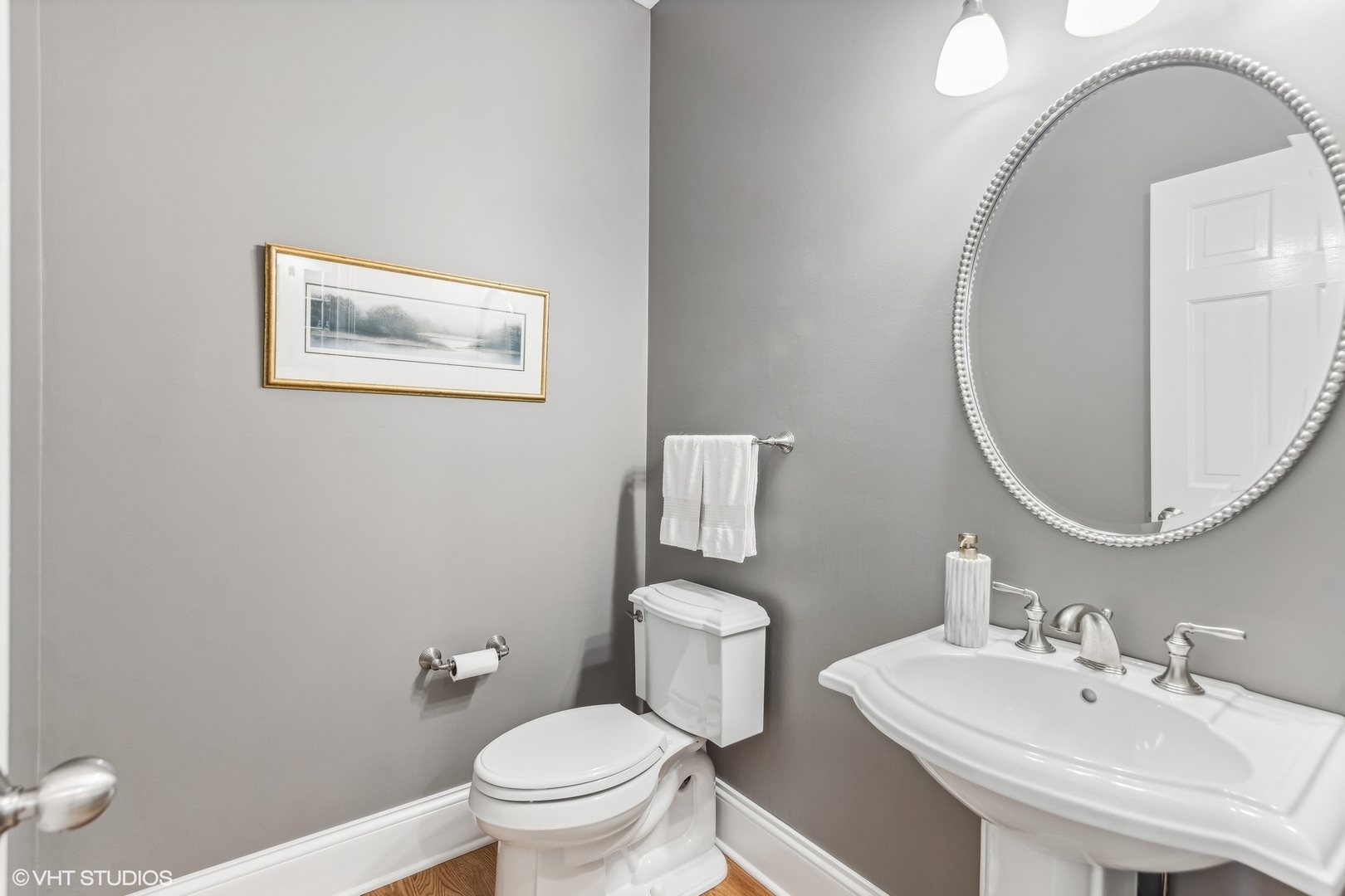 437 Stagecoach Run Glen Ellyn, IL 60137 - Photo 22 of 45 a bathroom with a toilet a sink and a mirror