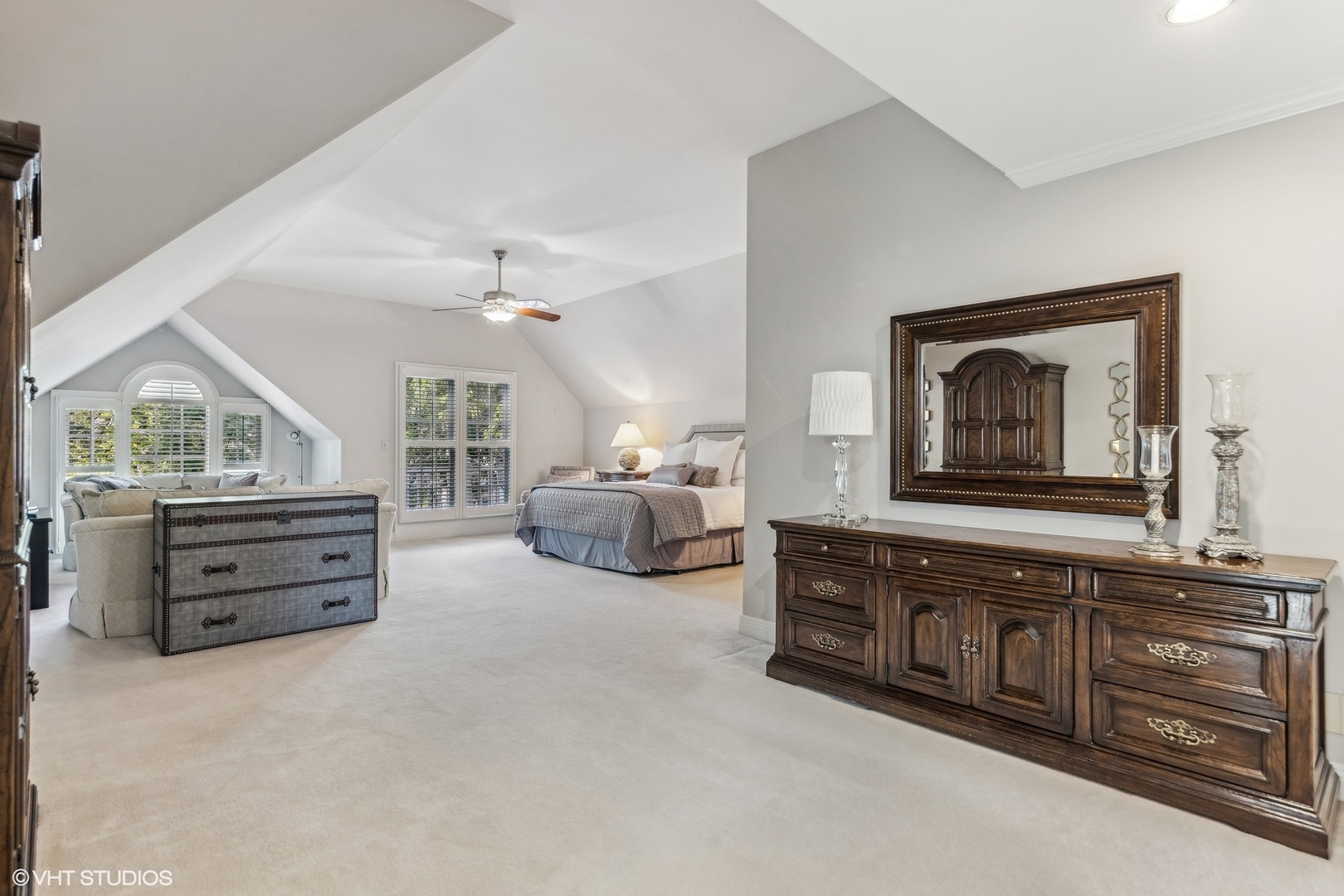 437 Stagecoach Run Glen Ellyn, IL 60137 - Photo 24 of 45 a spacious bedroom with a bed a dresser and a large mirror