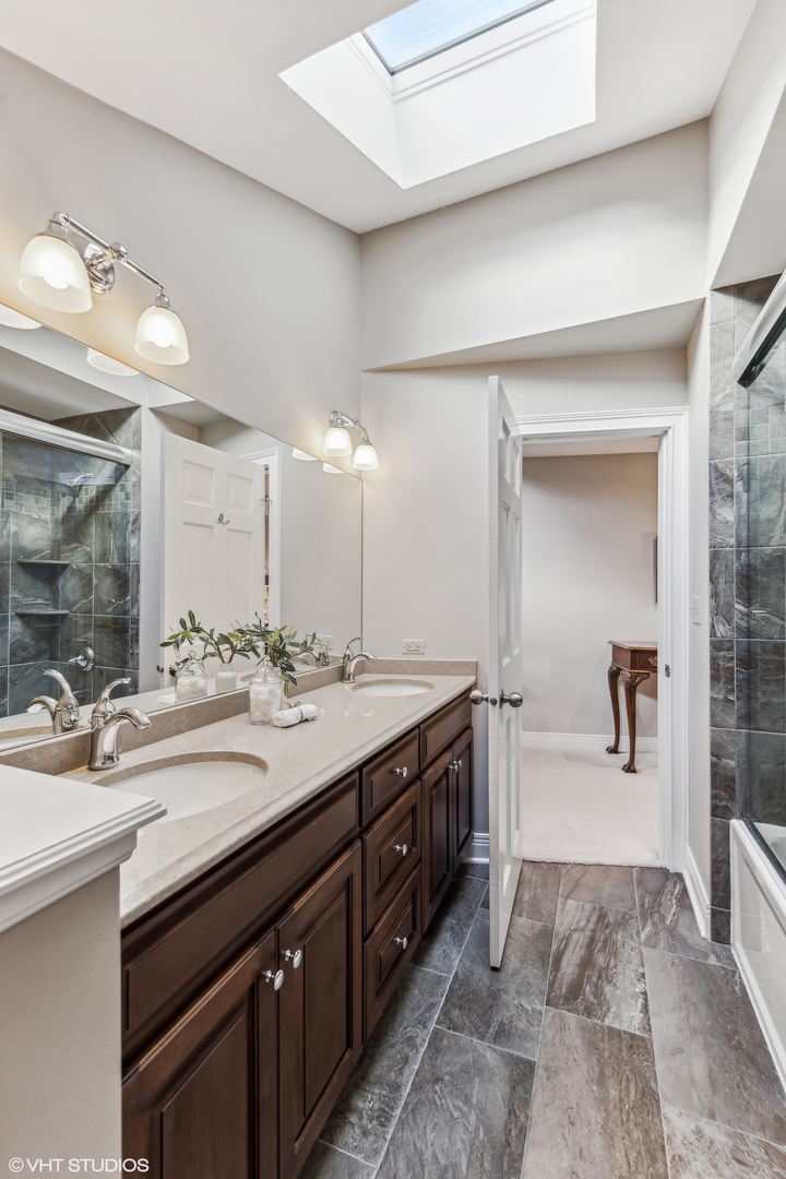 437 Stagecoach Run Glen Ellyn, IL 60137 - Photo 33 of 45 a spacious bathroom with a double vanity sink and a mirror