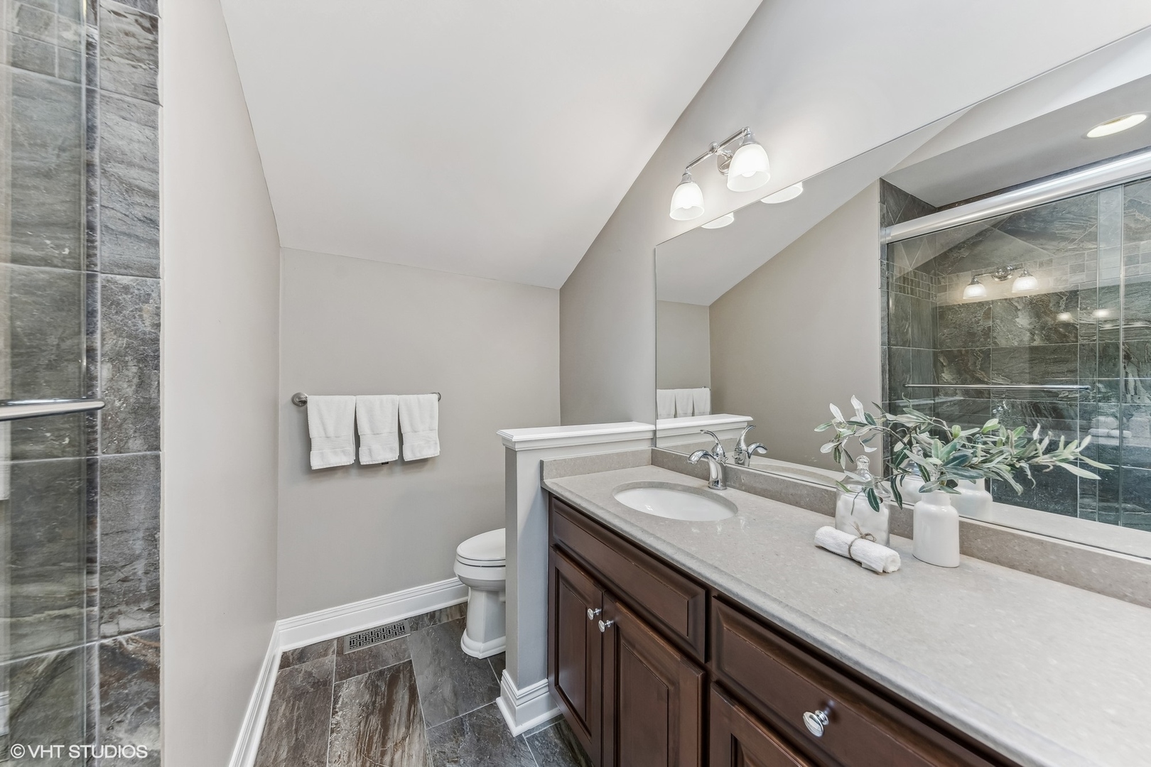 437 Stagecoach Run Glen Ellyn, IL 60137 - Photo 34 of 45 a spacious bathroom with a granite countertop sink a toilet a mirror and vanity