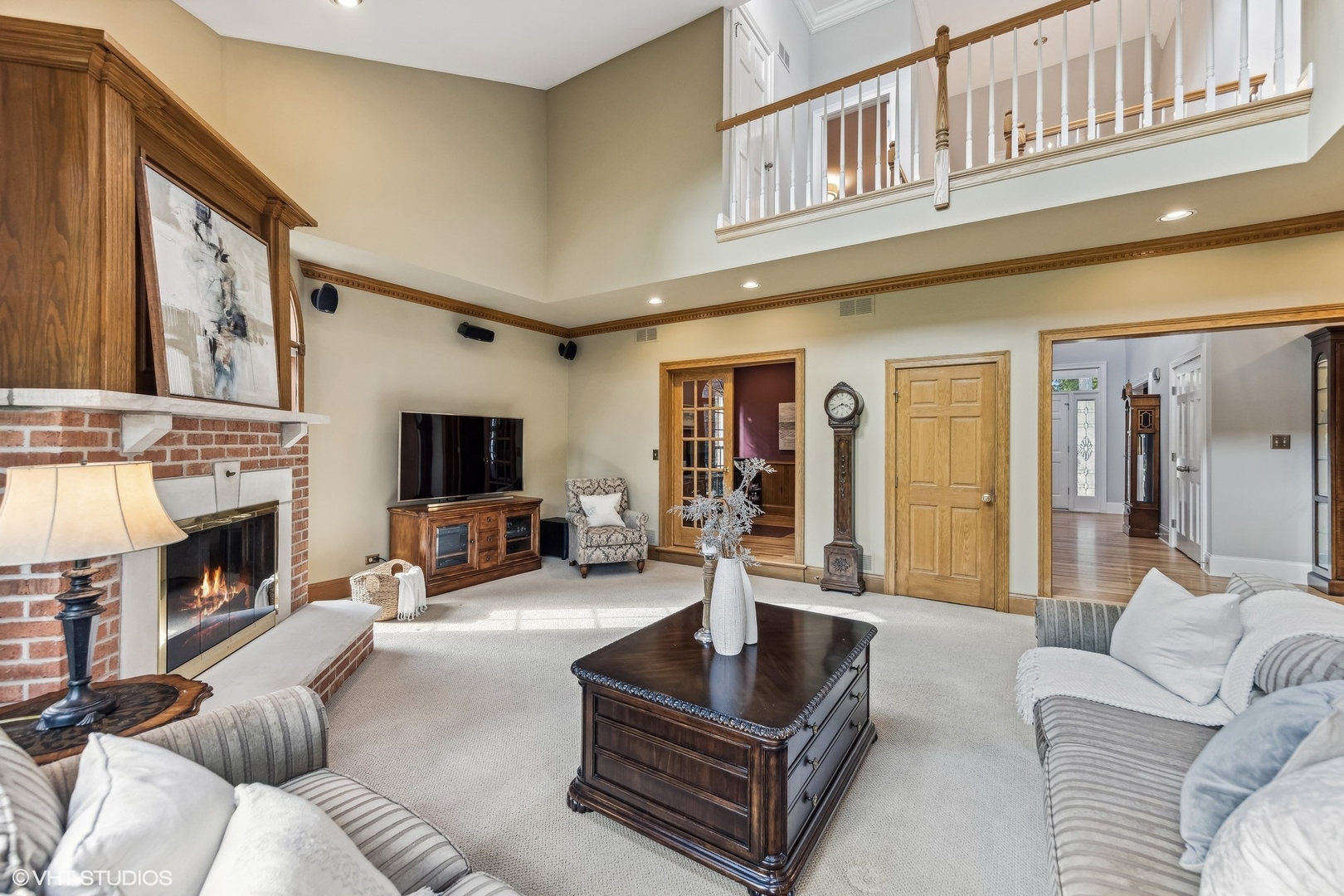 437 Stagecoach Run Glen Ellyn, IL 60137 - Photo 8 of 45 a living room with furniture a fireplace and a large window