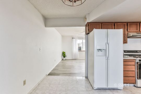 101 South Lilac Street Ridgecrest, CA 93555 - Photo 9 of 26 a view of a hallway with closet and a window