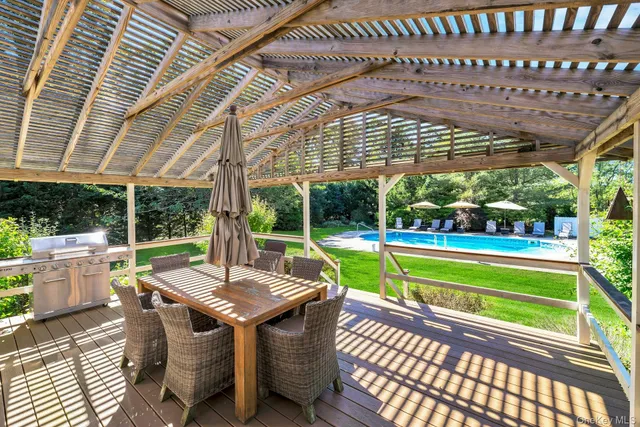 a view of a house with a yard and furniture