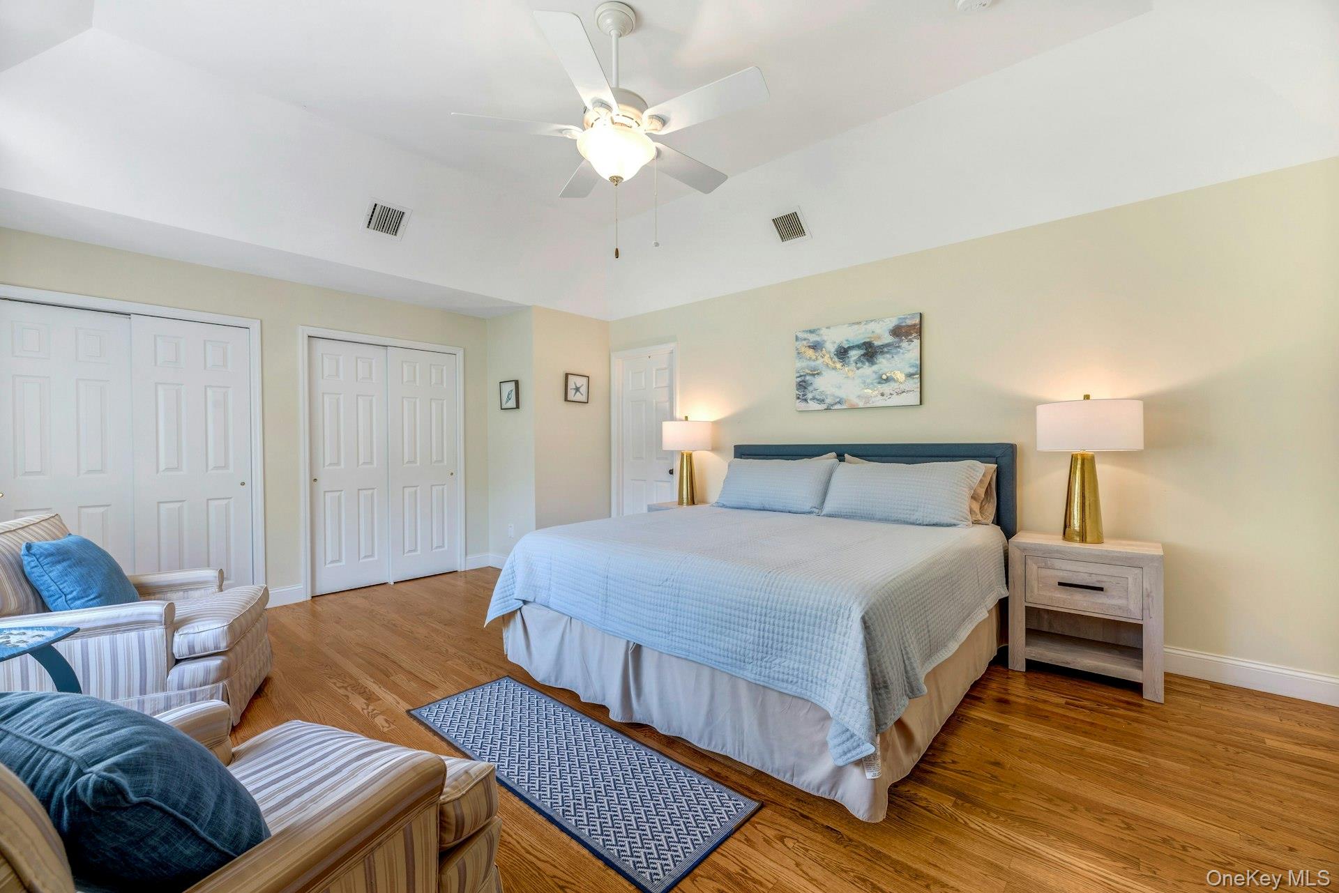 3045 Rocky Point Road East Marion, NY 11939 - Photo 6 of 22 a bedroom with a bed ceiling fan and a window