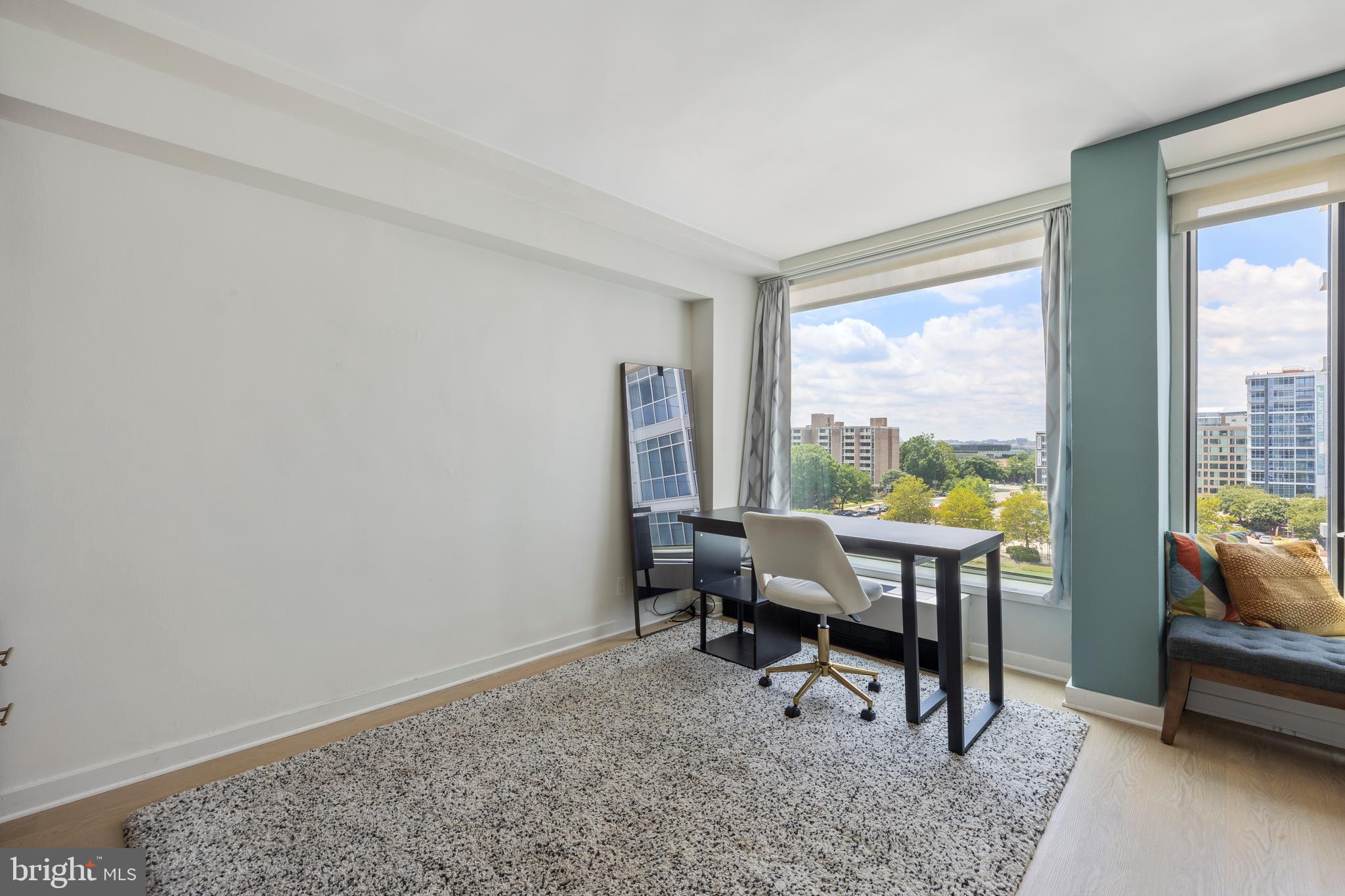 1101 3rd Street Southwest, Unit 705 Washington, DC 20024 - Photo 21 of 38 a room with furniture and a window