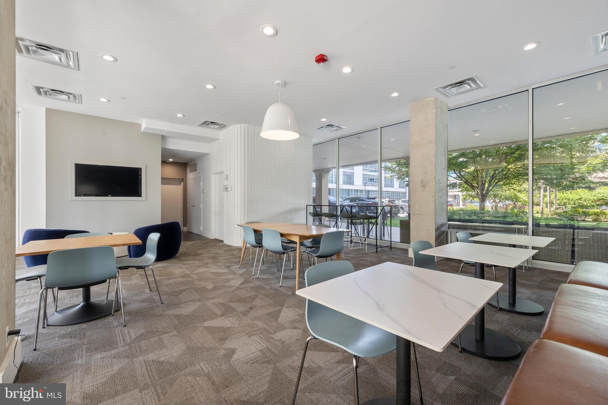 1101 3rd Street Southwest, Unit 705 Washington, DC 20024 - Photo 26 of 38 a outdoor space with furniture a rug and white walls