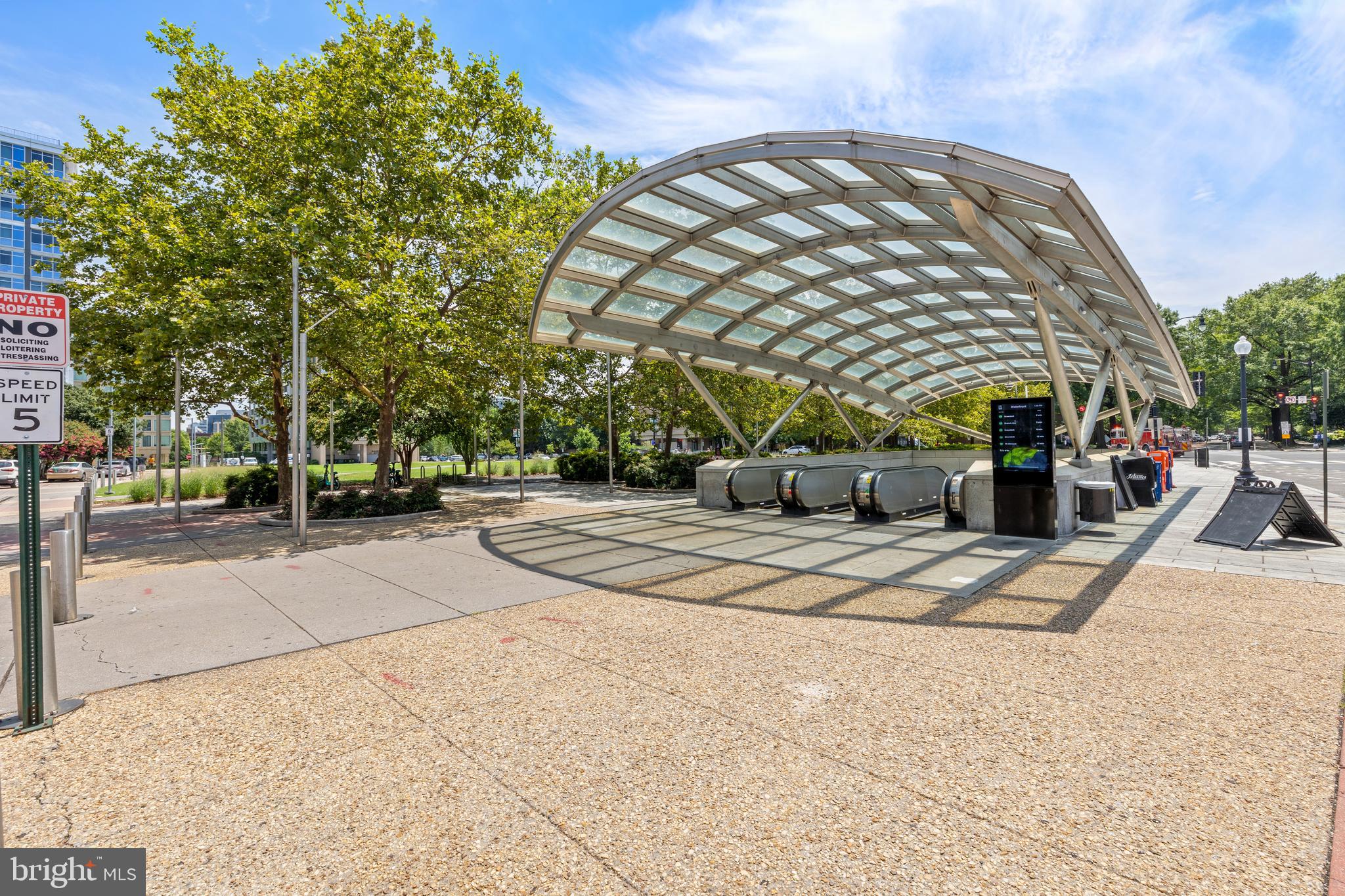 1101 3rd Street Southwest, Unit 705 Washington, DC 20024 - Photo 32 of 38 a building with trees in front of it
