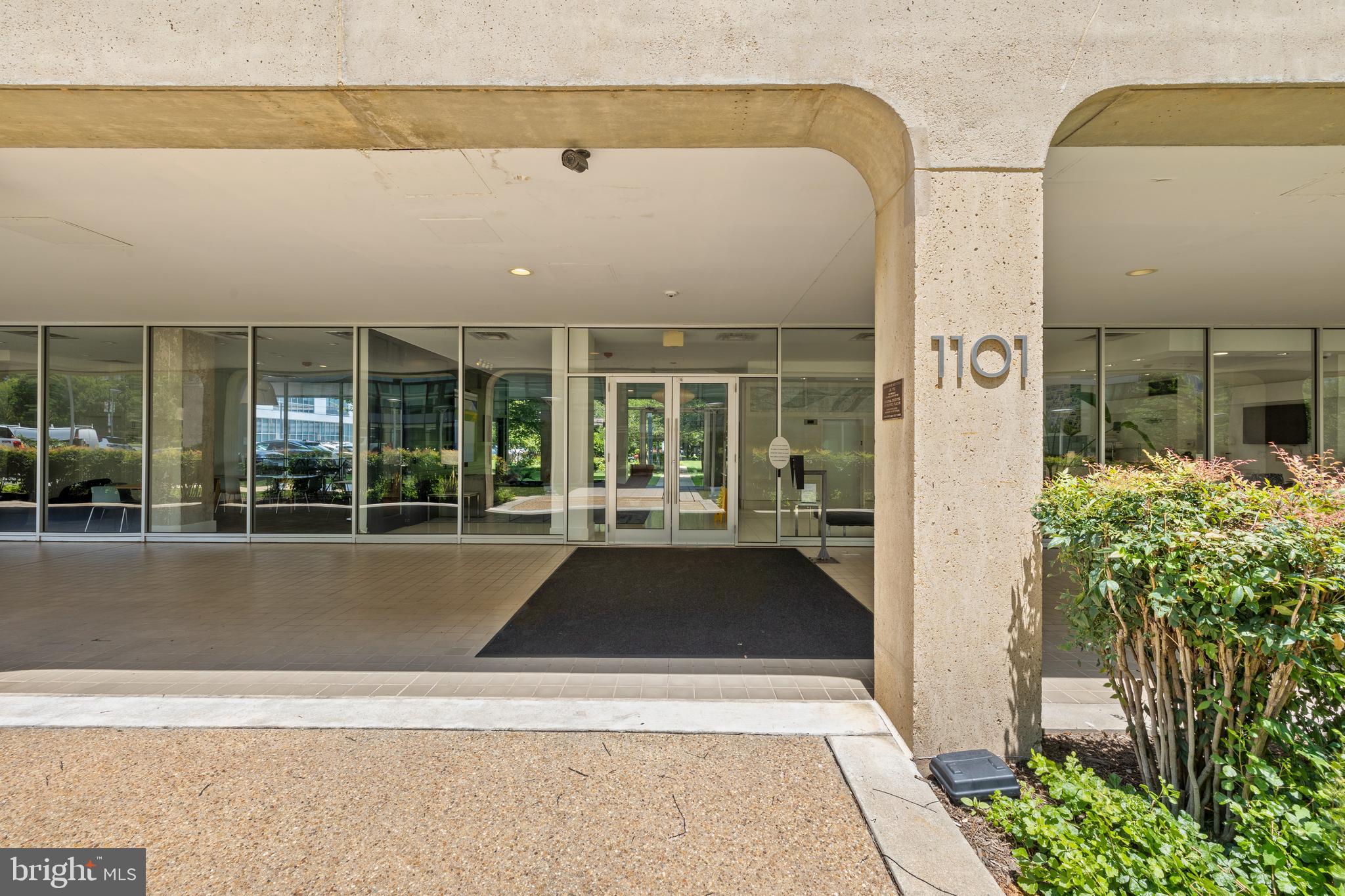 1101 3rd Street Southwest, Unit 705 Washington, DC 20024 - Photo 6 of 38 a front view of a house with a yard