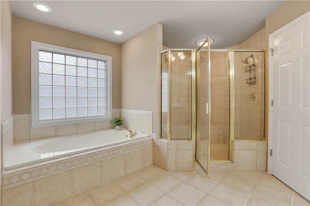 803 Rocky Ridge Court Canton, GA 30114 - Photo 34 of 74 a spacious bathroom with a large tub and shower