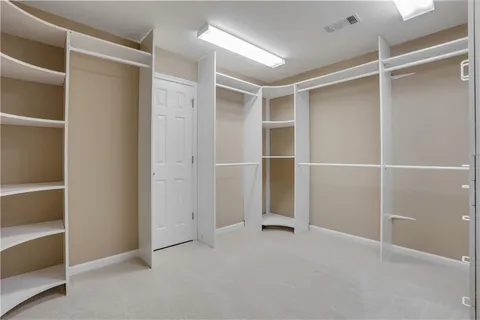 a kitchen with kitchen island a sink stainless steel appliances and a fireplace
