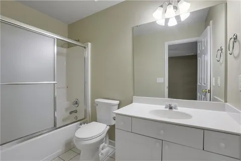 a kitchen with granite countertop stainless steel appliances a sink and cabinets