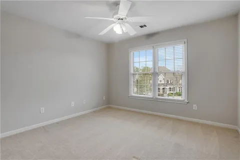 a kitchen with granite countertop stainless steel appliances a sink a stove a microwave and cabinets