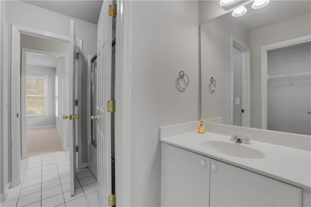 803 Rocky Ridge Court Canton, GA 30114 - Photo 42 of 74 a bathroom with a sink and a mirror