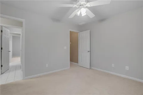 a view of a house with a yard and furniture