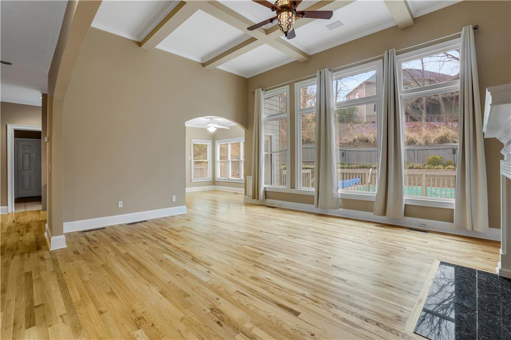 803 Rocky Ridge Court Canton, GA 30114 - Photo 6 of 74 a view of an empty room with a window and wooden floor