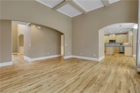 a kitchen with stainless steel appliances granite countertop a sink and a window