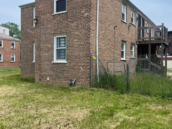 a brick building that has a lots of plants in it