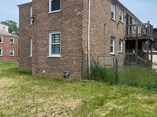 a brick building that has a lots of plants in it
