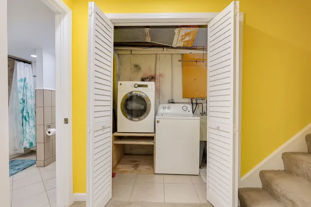 a view of a hallway with washer and dryer