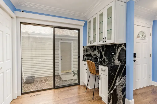 a view of front door with wooden floor
