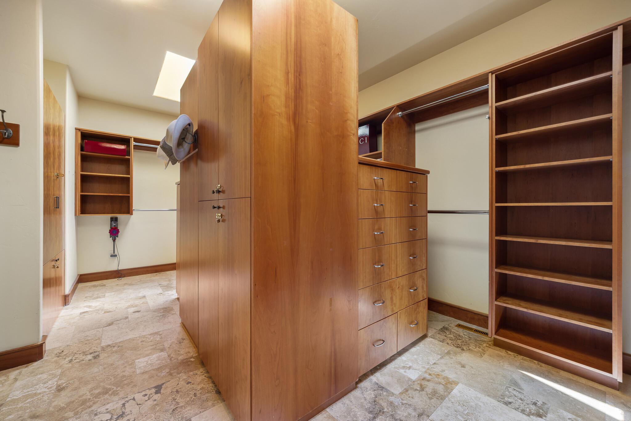 18883 Sutherland Court Bend, OR 97702 - Photo 28 of 70 Custom-built wardrobe cabinetry offers elegant organization and boutique-level style.