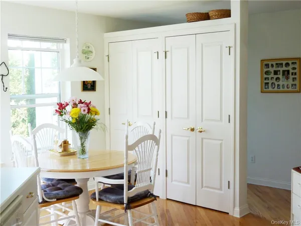 a dining room with furniture and window