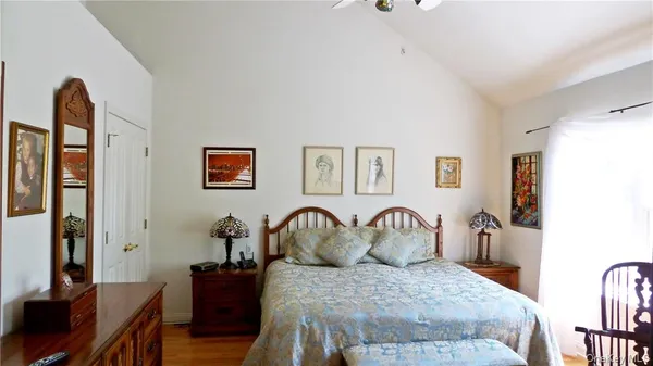 a bedroom with furniture and a window