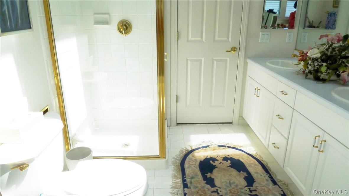 107 Winding Ridge Road, Unit 107 White Plains, NY 10603 - Photo 15 of 30 a bathroom with a sink and a mirror